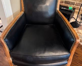 Vintage wooden armchair in buttery black leather