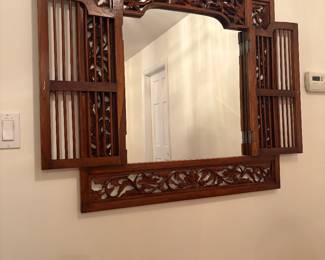 Ornate carved decorative mirror