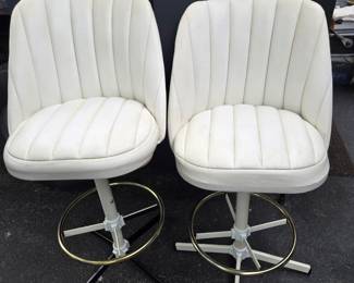 Pair of white vinyl barstools