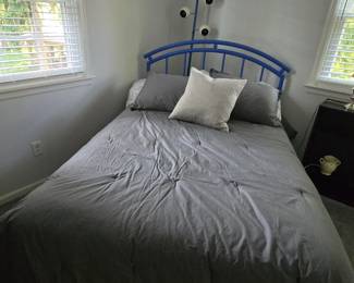 Blue metal tube frame bed
