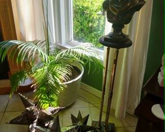 Metal bust, antique fern stand, punched tin Moravian star lanterns.