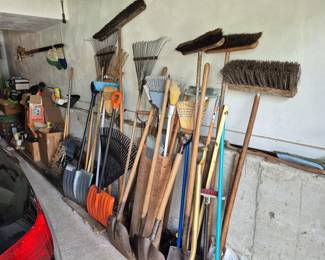 Lot 58: Assorted Yard Tools Including Brooms, Rakes, and Shovels