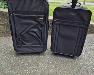 Lot 52: Two Black Rolling Suitcases