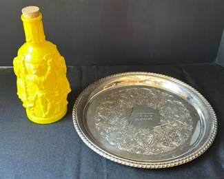Lot 1: Yellow embossed decanter bottle and ornate silver tray