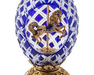 Lot 1243 House of Igor Carl Fabergé, (Russian) 'Sapphire Inspiration' Crystal, Enamel and Gilt Metal Carousel Egg, H 7.5" Dia. 3.5" 1 PC