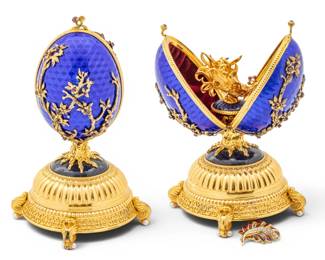 Lot 1231 House of Igor Carl Fabergé, Sterling Silver 24-karat Gold Plated, Enamel and Ruby Egg 1987, 'Musical Firebird Egg', H 7" Dia. 3.5"
