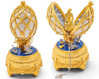 Lot 1228 House of Igor Carl Fabergé, (Russian) 24K Gold Plated Sterling Silver, Guilloché Enamel, Sapphire, and Pearl 'Swan Lake Imperial Egg', H 7" Dia. 3.5"