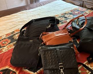 assorted purses and hand bags