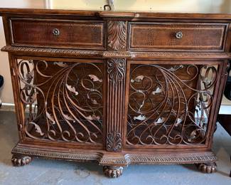 Ornate cabinet with wine racks 
