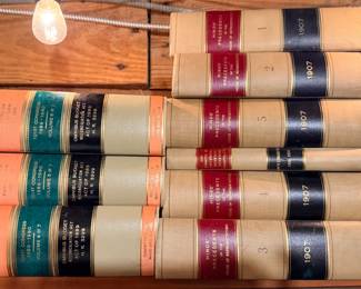 Lot includes two sets of highly specialized, antique and vintage official US government congressional law volumes.  The physical bindings feature classic law buckram cloth with dual red and black leather spine labels, giving them a striking, stately aesthetic.