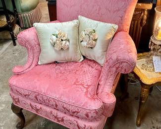Custom upholstered wing chair with Rosette throw pillows