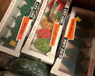 several Lionel trains, buildings, tracks in original boxes