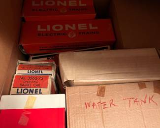 several Lionel trains, buildings, tracks in original boxes