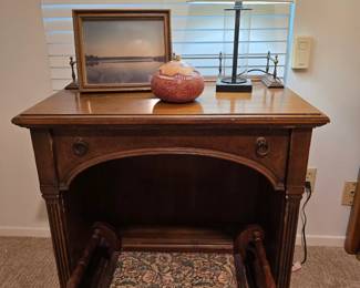 Antique knee-hole desk by Brandt and wood, needlepoint foot stool