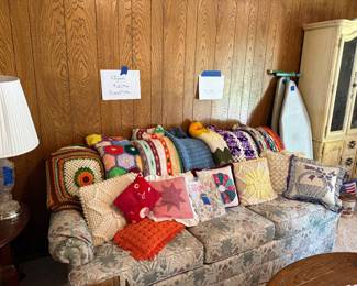 Homemade Afghans, pillows and a sleeper sofa