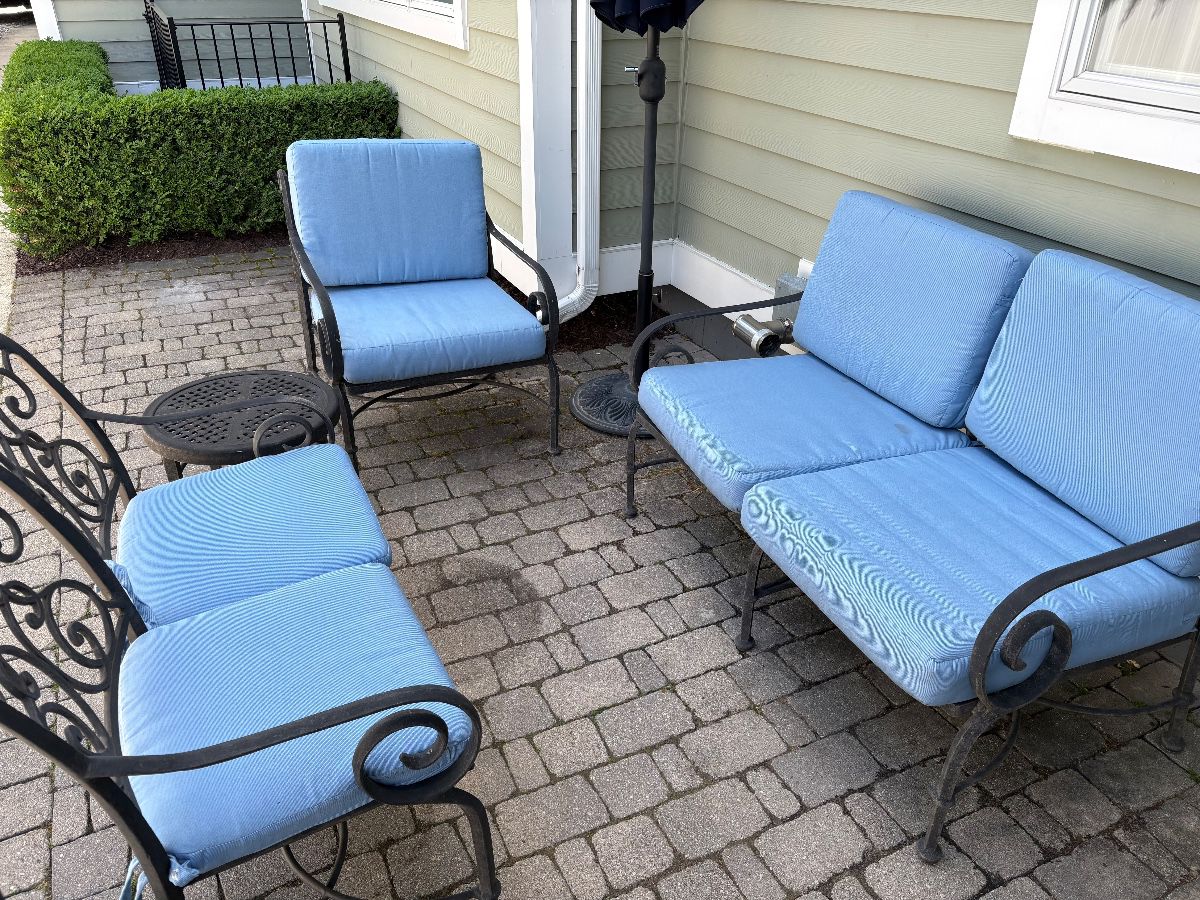 Cast aluminum patio furniture with cushions and umbrella with stand