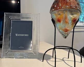 Waterford picture frame and Sand-cast "faces" artwork