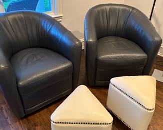 Leather swivel club chairs - dark charcoal/almost black and leather storage ottomans in ivory with nail-head trim detail