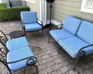 Cast aluminum patio furniture with cushions and umbrella with stand