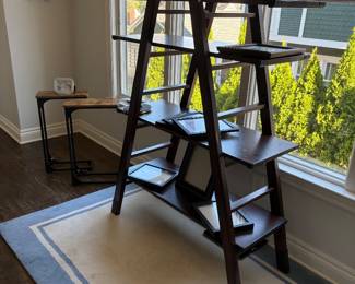 4-shelf ladder bookcase - picture frames, clock and area rug - available