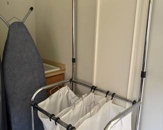 Laundry hamper and ironing board