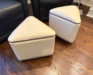 Another view of the ivory storage ottomans with nail-head trim detail