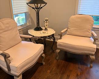 2 French upholstered Armchairs available and side table with metal base and fossile stone top, brass and iron table lamp with black shade