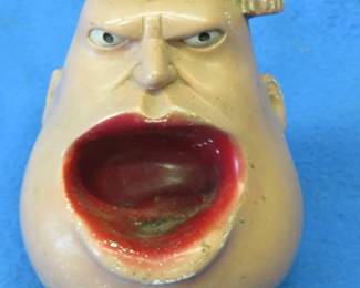 Lot 107. 1942 anti-Axis caricature ashtray of Benito Mussolini