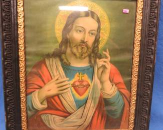 Lot 253. Sacred Heart of Jesus picture in a wooden ornate scrollwork frame. 25" X 20.5"