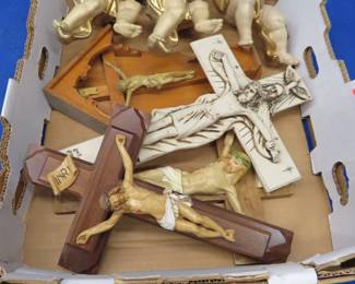 Lot 85. Four crucifixes and three plastic? cherubs