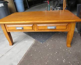 Lot 220. Lift top coffee table that rises to dinner table height. 48" W x 19" H or 28"H x 27"D. See photos for inside of table when raised.