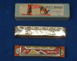 Lot 94. Two collectible harmonicas: P. Pohl tremolo enameled Comet harmonica with good sound. Vintage Hohner 28-reed diatonic great-sounding harmonica in the key of C with the box in VGC.