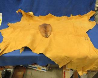 Lot 82. Tanned deer hide and muskrat hide