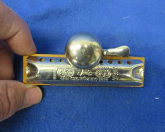 Lot 97. Weiss Glock (Bell) diatonic 8-hole harmonica. Minimum bid $15.