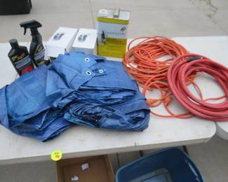 Lot 214. Box lot including air hose, extension cord, tarps, and more