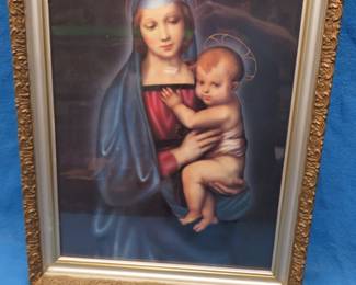 Lot 255. Framed reproduction of Madonna del Granduca by Rafael in a wooden 23.5" x 19" frame with resin? scrollwork.