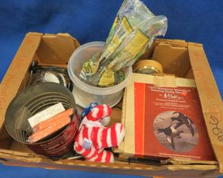 Lot 52. Collectible plates, bird seed, and more