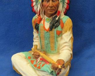 Lot 172. Resin Indian chief and peace pipe