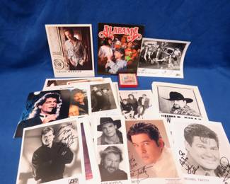Lot 264. Photos of many different country artists, many are autographed.