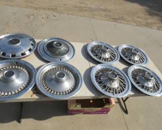 Lot 285. Eight Thunderbird hubcaps