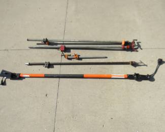 Lot 288. Four pipe clamps and a pole for and electric chain saw, and more