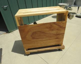 Lot 329. Rolling table Dimensions in inches: 36 x 20 x 34 with an Atwater Kent Radio. Untested