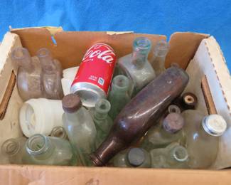 Lot 132. Old bottles, including Dr. Kilmer's Swamp Root and milk glass