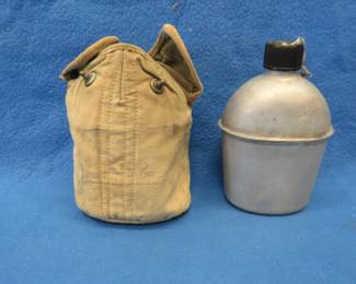 Lot 302. WW2 US canteen and canvas cover. Clean inside. Dated 1945.