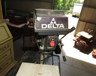 Lot 326. Delta benchtop drill press with a metal rolling cart