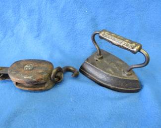 Lot 149. Old sad iron and small pulley