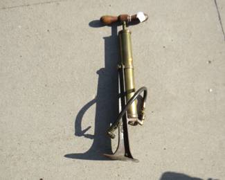 Lot 274. Antique brass air pump