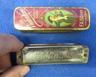 Lot 96. F.A. Bohn 10-hole Violin King diatonic harmonica in the key of C in a tin box. Poor sound.