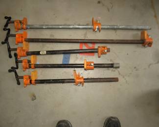 Lot 324. Three 18" and two 31" pipe clamps