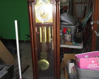 Lot 320. Colonial chiming grandfather clock. Beveled glass on 3 sides. 72 inches tall.